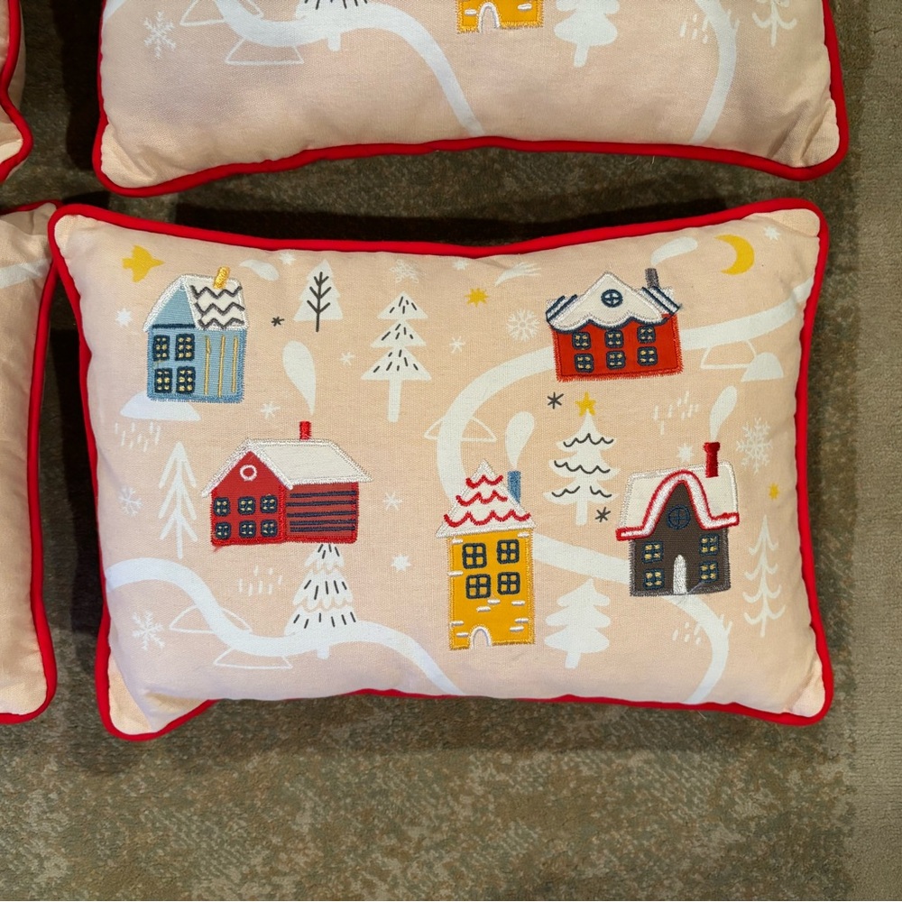 Christmas holiday throw pillows winter village houses. Red trim.